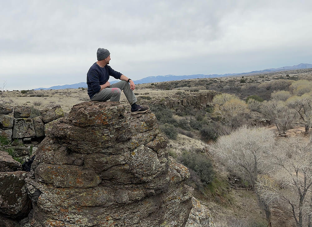 Ivan_on_Rock_tjp Ivan Fritz sitting on a rock looking at the desert.