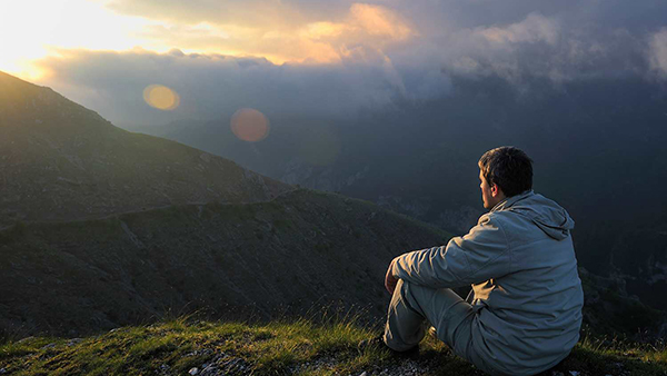 sunrise_600 Decorative Image: Person gazing at a vista, contemplating what kind of life they would like to build.